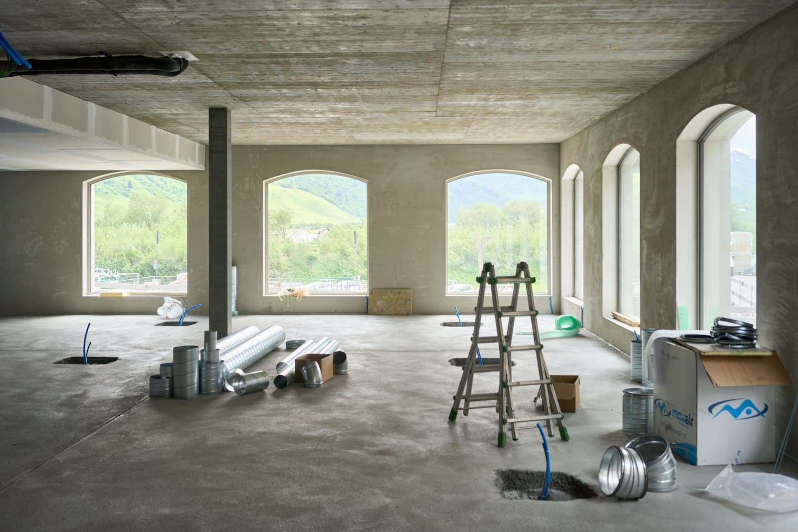 Interior under renovation with a ladder and building materials